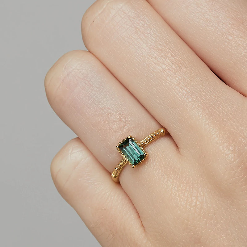 Ruth Tomlinson - Emerald Cut Tourmaline ring with beaded setting